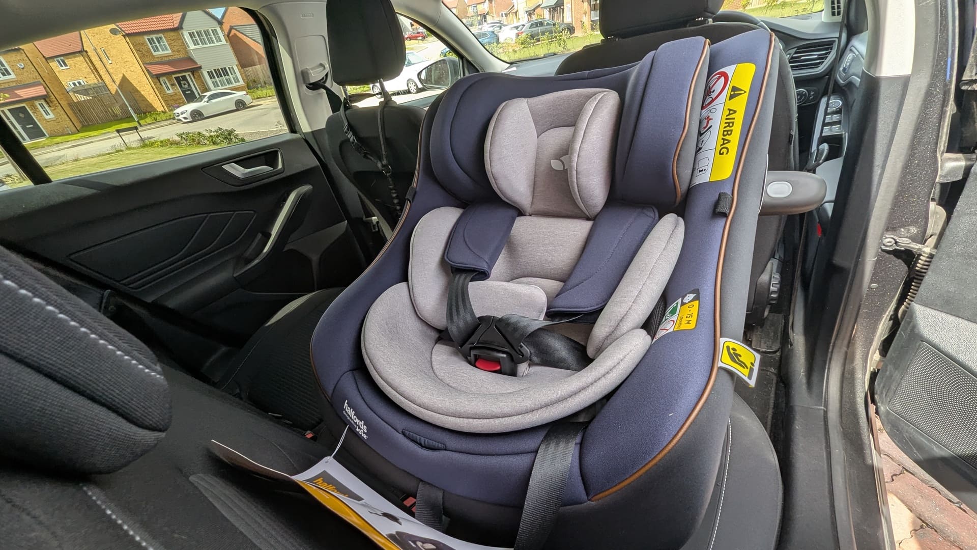 Joie for Halfords Idyll R129 Spin 360 car seat newly installed in a car with full newborn insert padding—featured in our Joie i-Spin 360 review.
